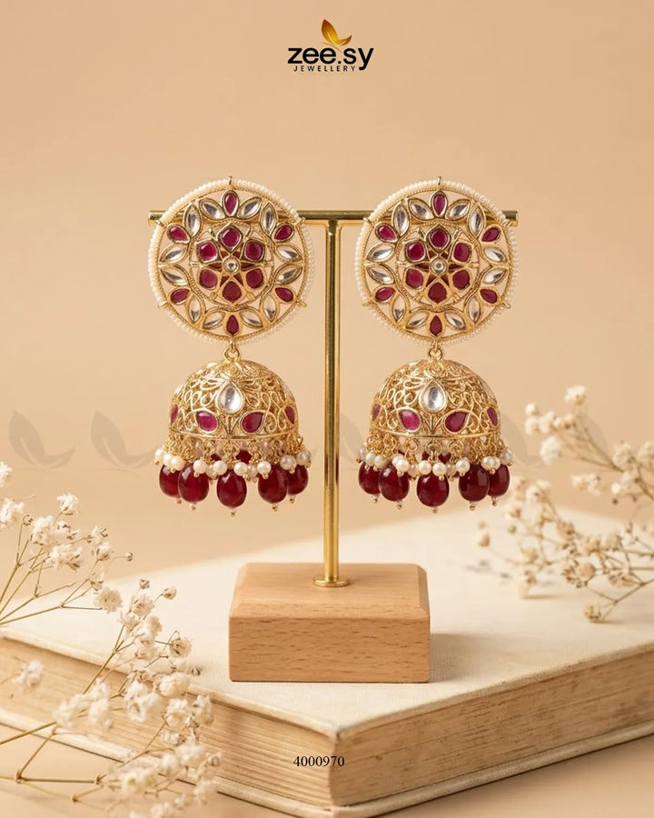 Elegant circular pearl and kundan Jhumkas earrings with intricate gold detailing, designed by RHS09.