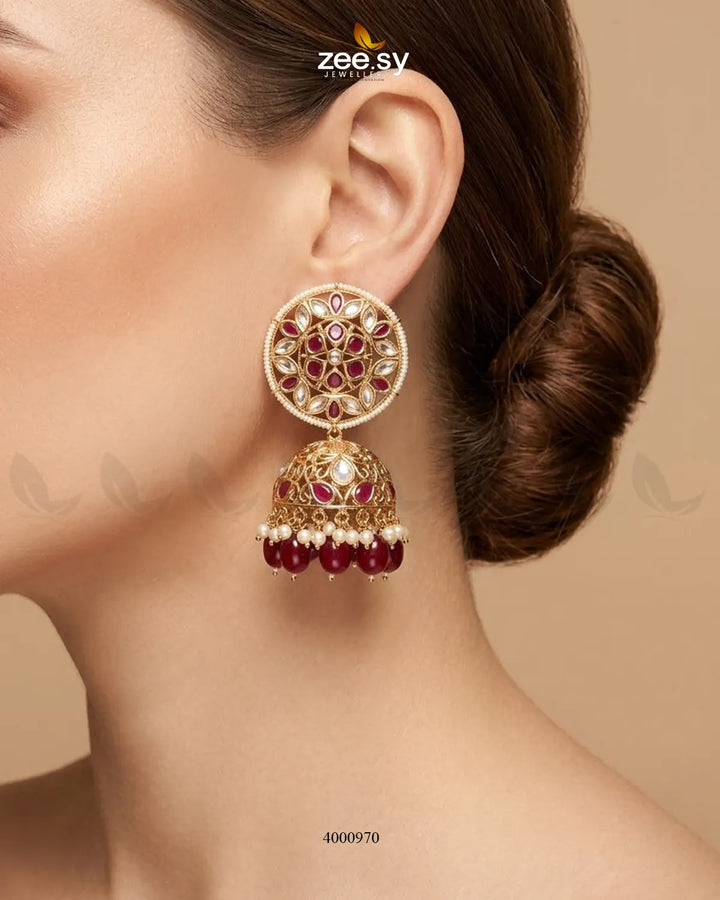 Elegant circular pearl and kundan jhumkas earrings with intricate design, featuring traditional craftsmanship by RHS09.