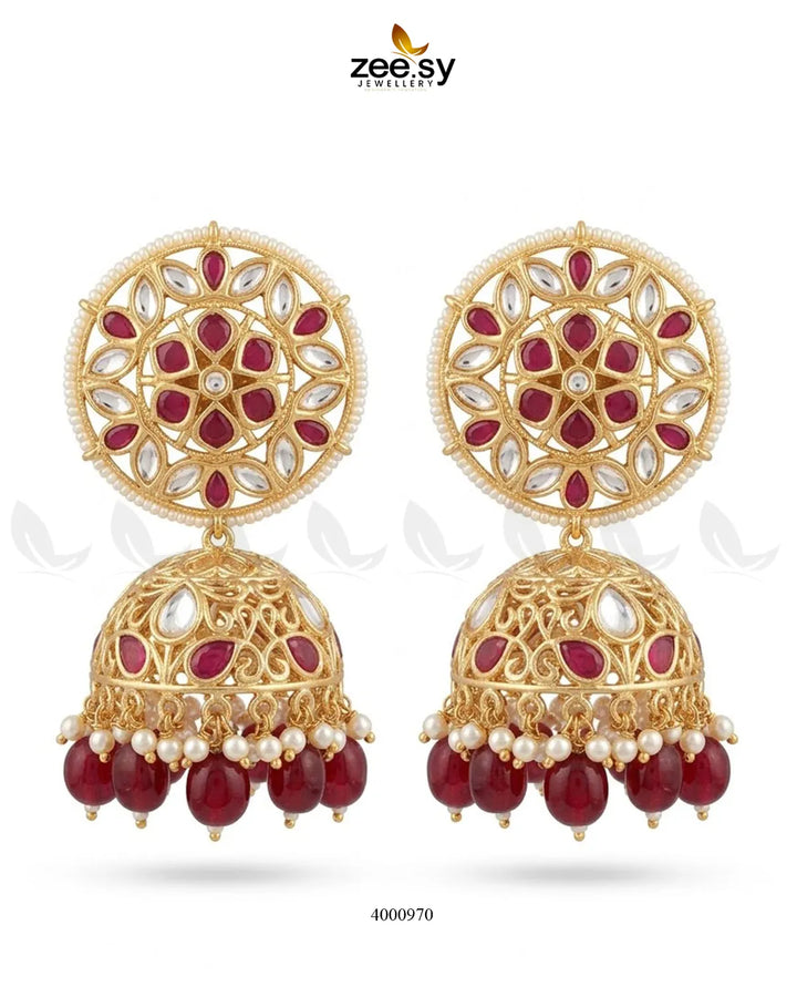 Elegant circular pearl Kundan Jhumkas earrings with intricate design, featuring shiny pearls and traditional craftsmanship.