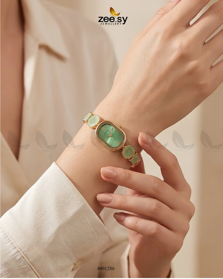 Elegant pastel green wrist watch by AJ03 featuring a sleek design and a comfortable strap, perfect for accessories.