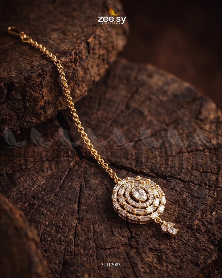 White Liana Bindiya by RHS09 featuring elegant floral design and intricate detailing on a traditional bindiya.