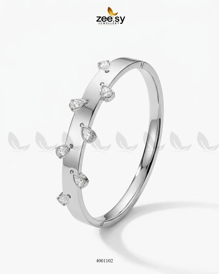 Silver minimalist droplet cuff bracelet by MH26, featuring a sleek, modern design with smooth, curved edges.