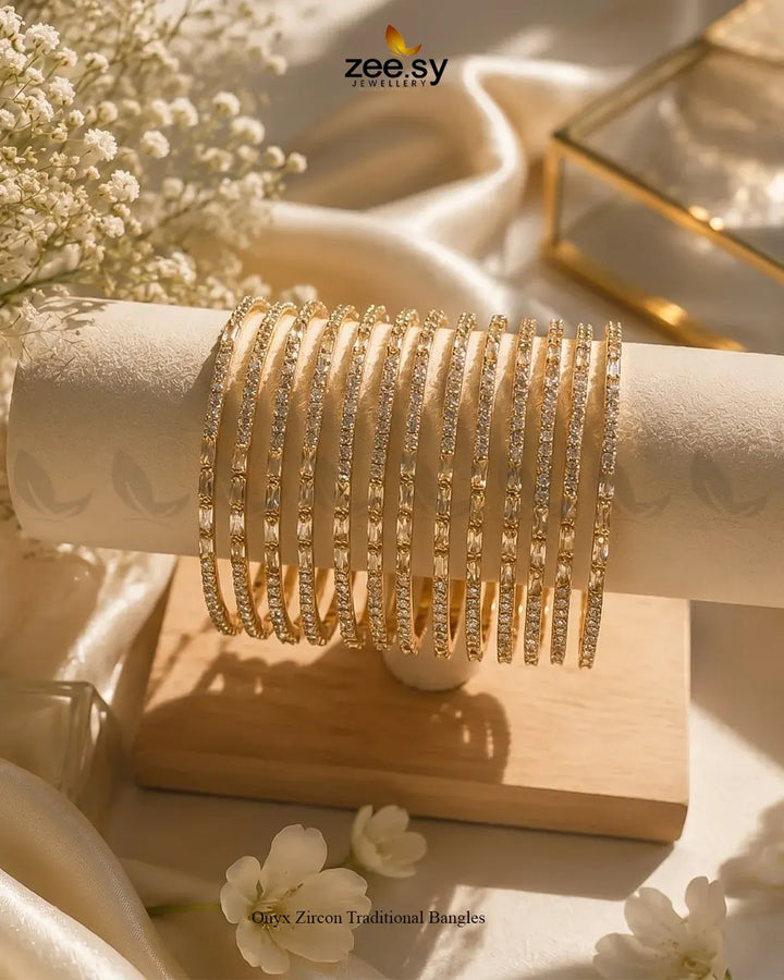 Elegant Onyx Zircon traditional bangles in champagne color, featuring intricate designs and sparkling accents, by AJ03.