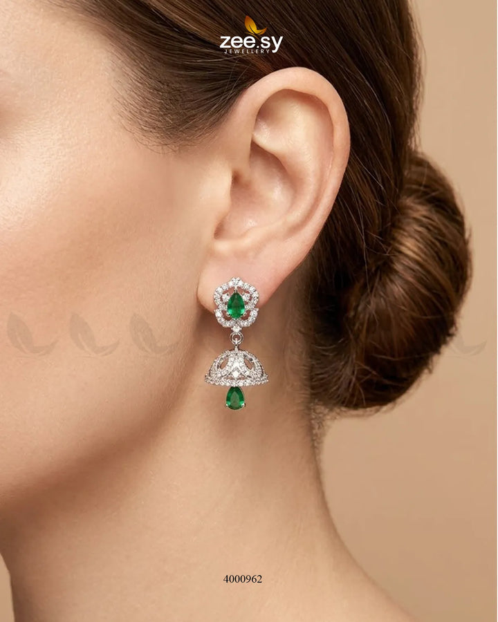 Ornate American diamond jhumka earrings with intricate design and dangling elements showcasing traditional craftsmanship.