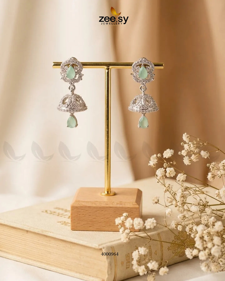Ornate American diamond jhumka earrings featuring intricate design and green mint accents, crafted by RHS09.
