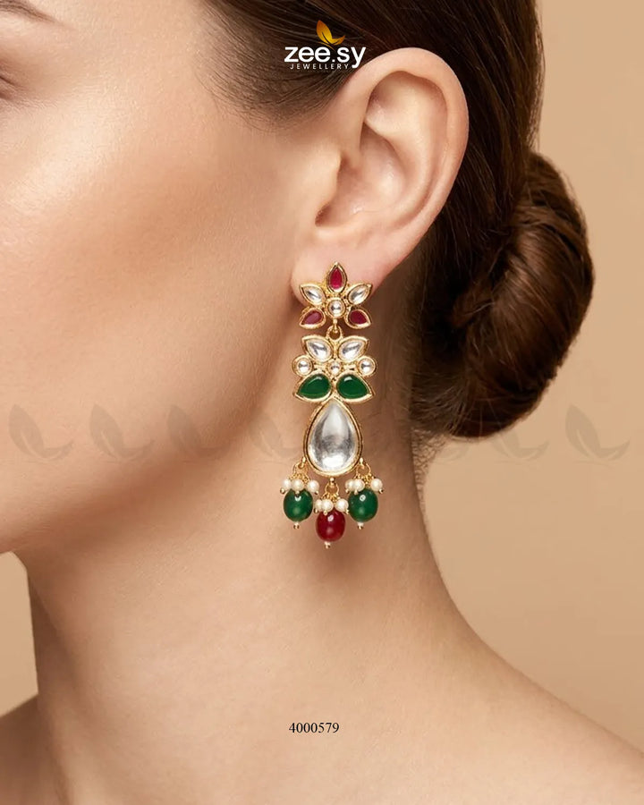RHS09 ornate floral Polki statement earrings with intricate design and vibrant ruby and green accents, showcasing detailed craftsmanship.