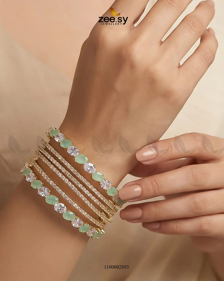 Mint green oval gemstone paved bangle by AJ03, featuring a stylish design with sparkling gemstone accents on a sleek bangle.