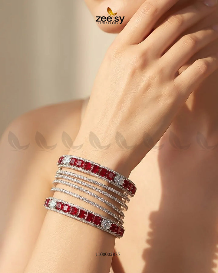 Silver princess cut zirconia bangle by AJ03 featuring sparkling gemstone accents on a sleek, elegant design.
