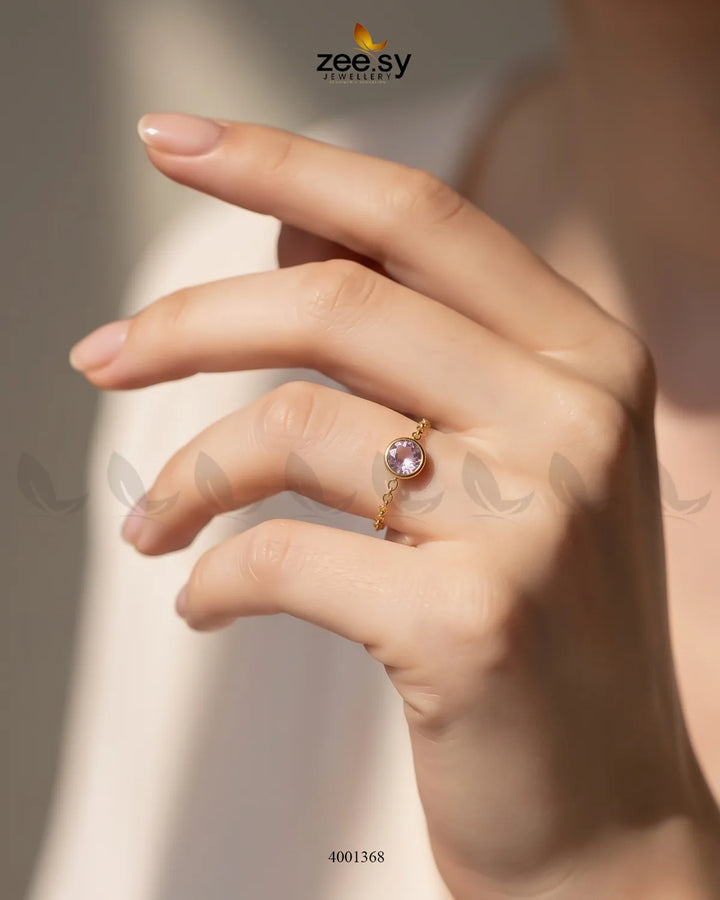 AJ03 Scarlet round stone finger ring with a pink mint gemstone, showcasing a sleek and stylish jewelry design.