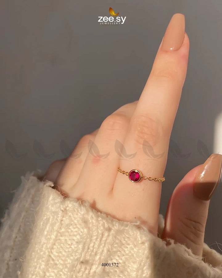 AJ03 Scarlet round stone finger ring featuring a vibrant red gemstone and a sleek band design.