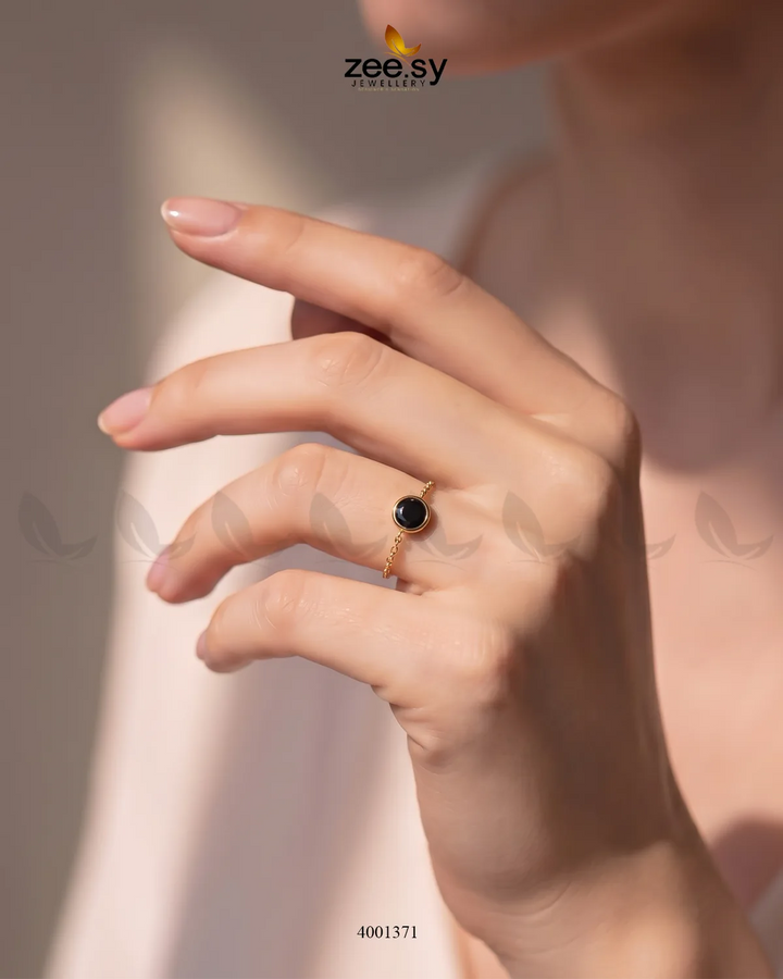Black scarlet round stone finger ring by AJ03, featuring a polished round gemstone setting on a sleek band.