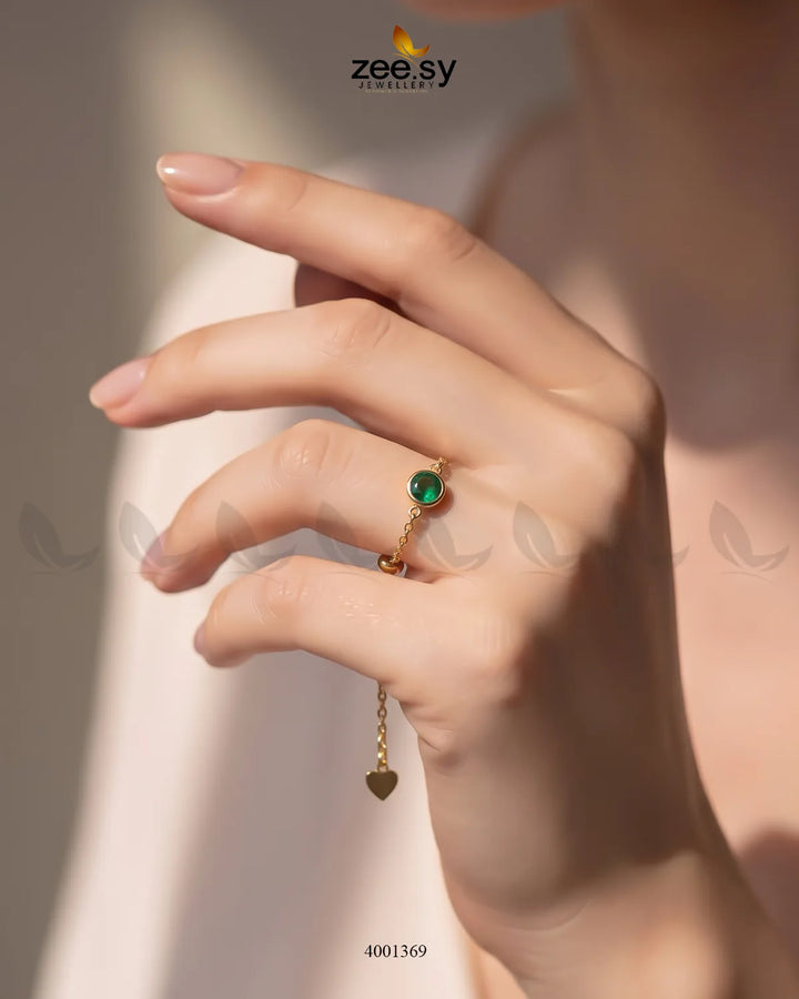 AJ03 Scarlet round stone finger ring with vibrant green gemstone and sleek silver band, showcasing elegant jewelry design.