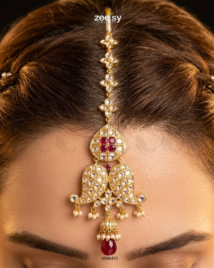 Traditional Polki Jhumki earrings with intricate gold detailing and dangling pearls, crafted by RHS09.