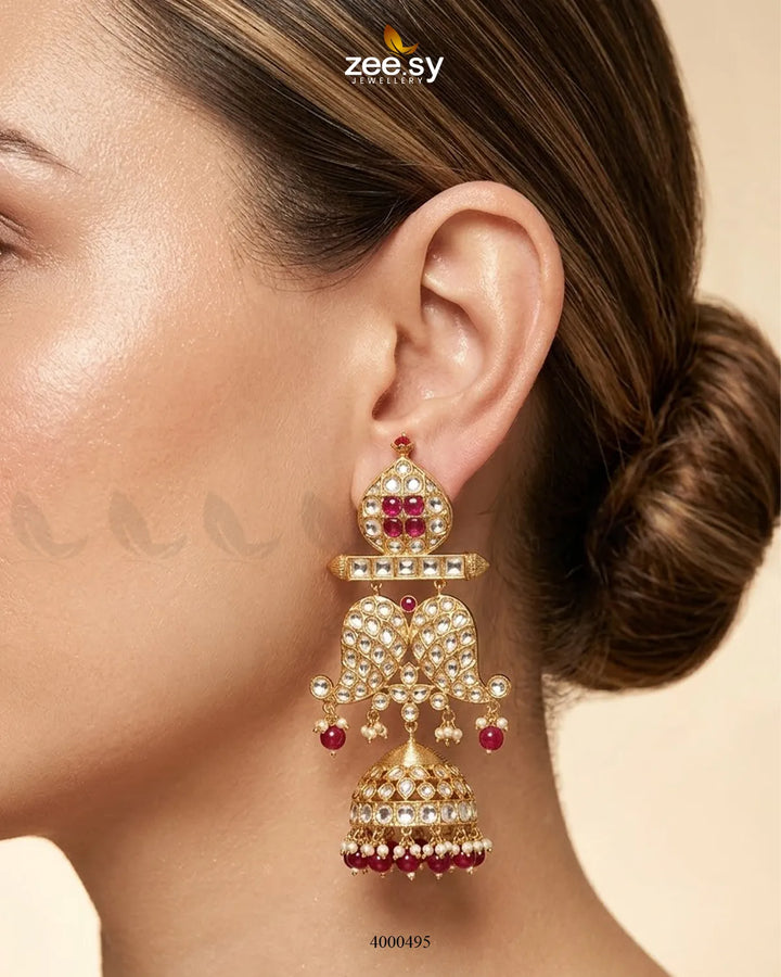 Traditional Polki Jhumki earrings with intricate gold and gemstone detailing, showcasing elegant Indian jewelry craftsmanship.