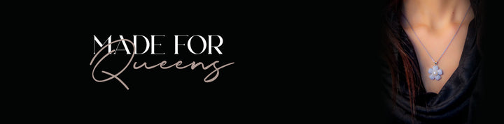 Luxury black and gold jewelry brand logo featuring elegant necklace with gemstone on dark background