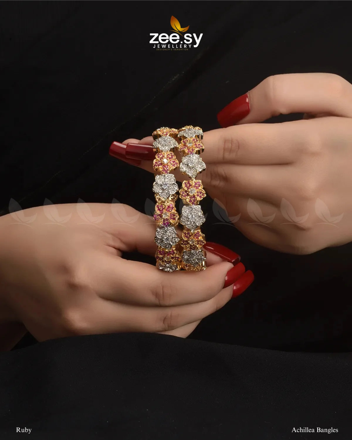 Achillea Bangles, a traditional kangan set featuring intricate floral patterns, adorned with uncut white stones and vibrant accent gems. Embellished with dazzling American cut diamond stones and finished with a rhodium polish, these handcrafted kadas exude elegance, making them ideal for weddings, bridal wear, and festive occasions.