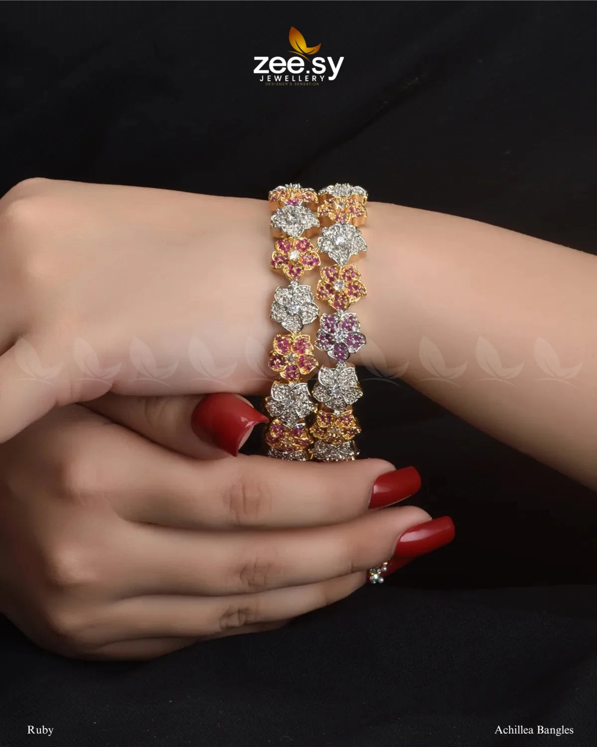 Achillea Bangles, a traditional kangan set featuring intricate floral patterns, adorned with uncut white stones and vibrant accent gems. Embellished with dazzling American cut diamond stones and finished with a rhodium polish, these handcrafted kadas exude elegance, making them ideal for weddings, bridal wear, and festive occasions.