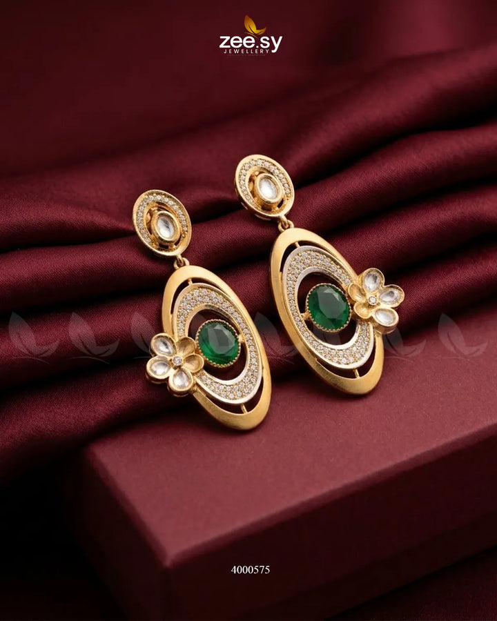A pair of RHS09 Ameera gemstone drop earrings with green gemstones and gold-tone accents, elegant jewelry for special occasions.