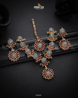 Aquilegia Necklace Set, a captivating floral-inspired design that blends modern elegance with traditional charm. Each intricately detailed flower motif is adorned with dazzling crystal glass stones, creating a striking contrast and luxurious appeal. Perfect for special occasions, this exquisite piece adds a radiant touch to any look.