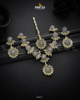 Aquilegia Necklace Set, a captivating floral-inspired design that blends modern elegance with traditional charm. Each intricately detailed flower motif is adorned with dazzling crystal glass stones, creating a striking contrast and luxurious appeal. Perfect for special occasions, this exquisite piece adds a radiant touch to any look.