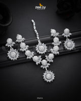 Aquilegia Necklace Set, a captivating floral-inspired design that blends modern elegance with traditional charm. Each intricately detailed flower motif is adorned with dazzling crystal glass stones, creating a striking contrast and luxurious appeal. Perfect for special occasions, this exquisite piece adds a radiant touch to any look.