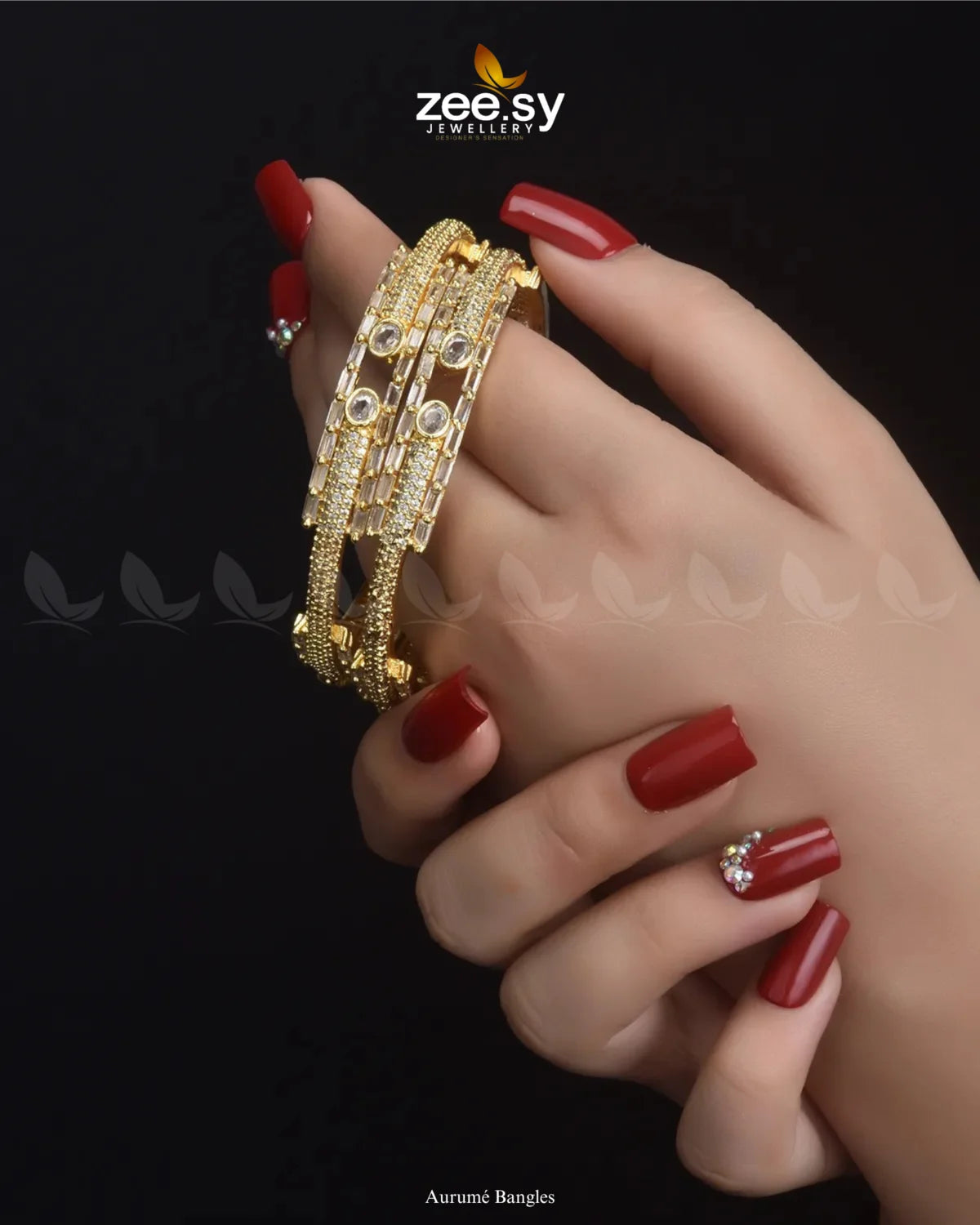 Aurumé Bangles, featuring a unique blend of elegance and modern craftsmanship. Designed with a golden polish, these exquisite kangans are adorned with dazzling diamond-cut stones and delicate stones, exuding a refined charm. The structured pattern and exquisite detailing enhance their luxurious appeal, making this kada an ideal choice for weddings, festive occasions, and special celebrations.