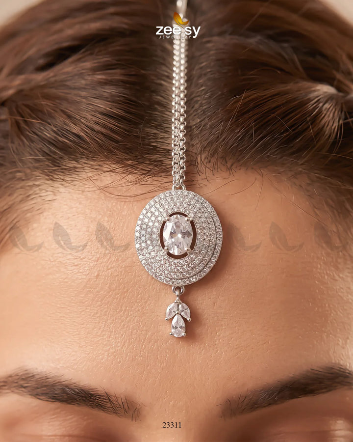 White Bindiya-0226 from RHS09, traditional Indian decorative bindi with intricate design, shown on a plain background.
