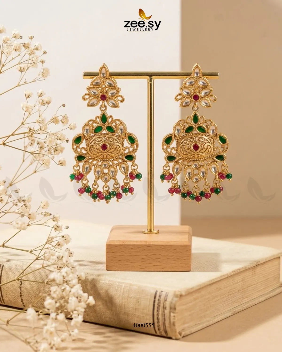 Red and green carved drop bead Kundan earrings with intricate detailing, featuring traditional Indian jewelry craftsmanship.