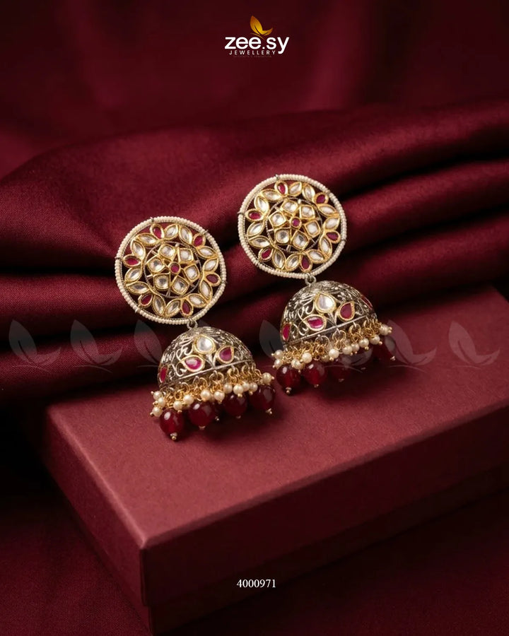 Elegant circular pearl and kundan jhumkas earrings featuring intricate gold design, perfect for traditional Indian jewelry styles.