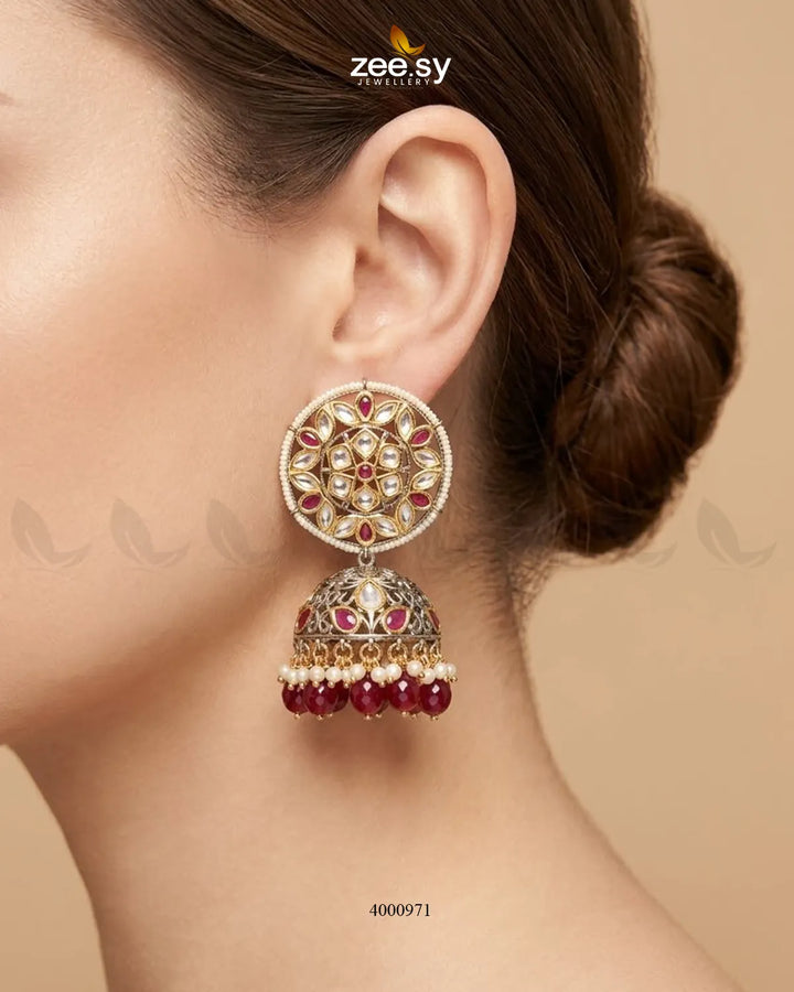 Elegant circular pearl and kundan jhumkas earrings by RHS09 featuring intricate design and traditional craftsmanship.