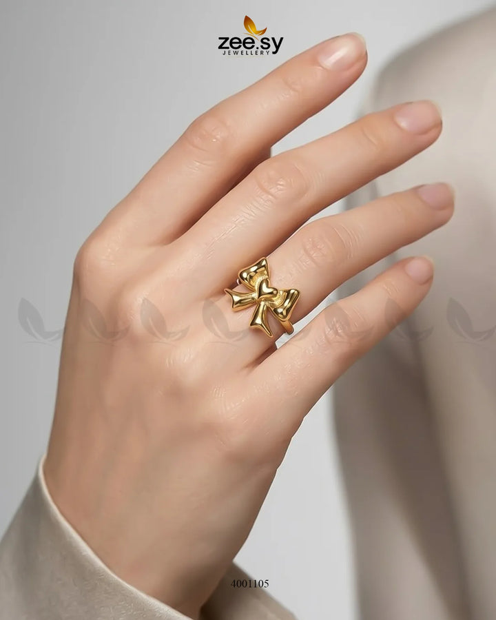 Silver Elegance Curved Bowknot cocktail ring with a sleek design, featuring a prominent bowknot detail in a close-up shot.