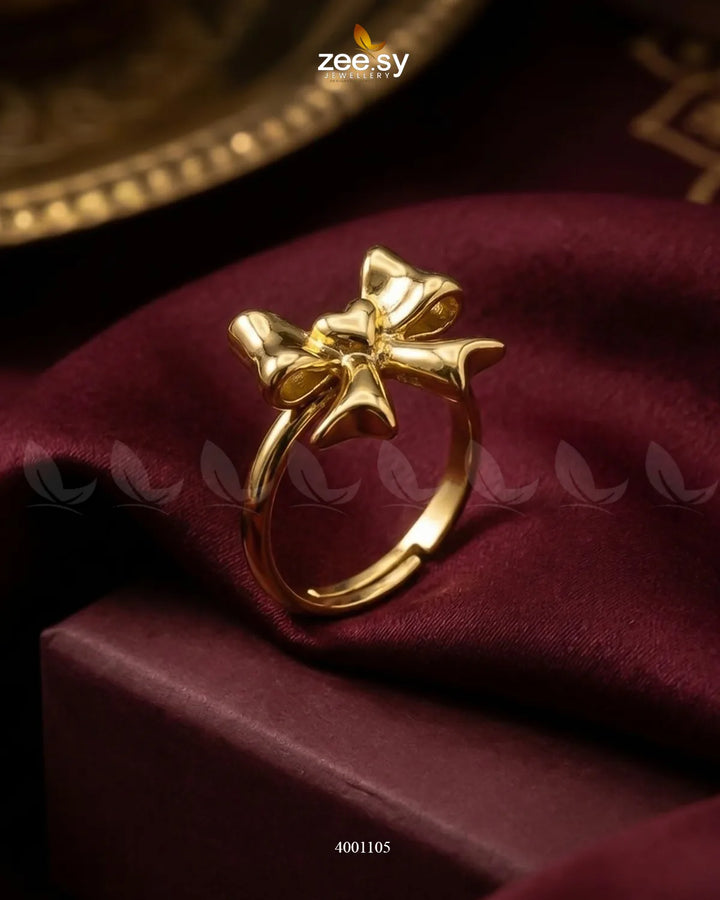 Elegant AJ03 curved bowknot cocktail ring with intricate design and shiny finish, showcasing its stylish and sophisticated appearance.