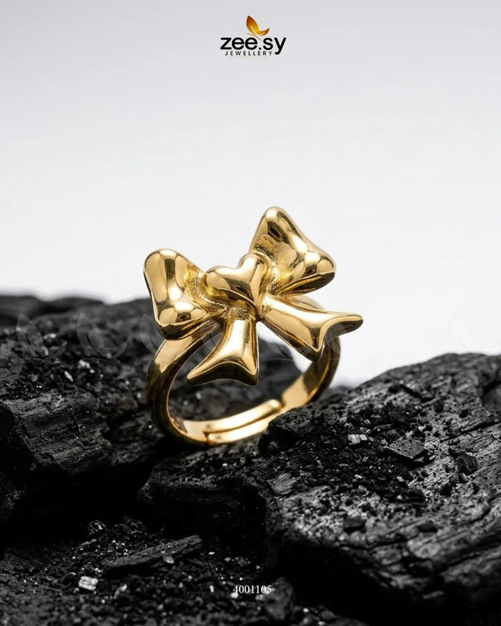 Silver Elegance Curved Bowknot Cocktail Ring by AJ03 featuring a sleek, curved bowknot design for stylish evening wear