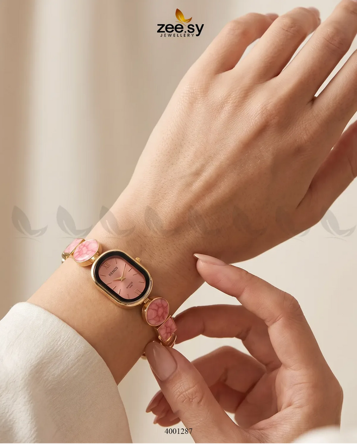Elegant pastel red wrist watch by AJ03 with a sleek design, featuring a round dial and matching strap, perfect for accessories.