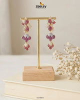 RHS09 golden flower dangler cluster earrings with intricate floral design and elegant drop style, set against a neutral background.