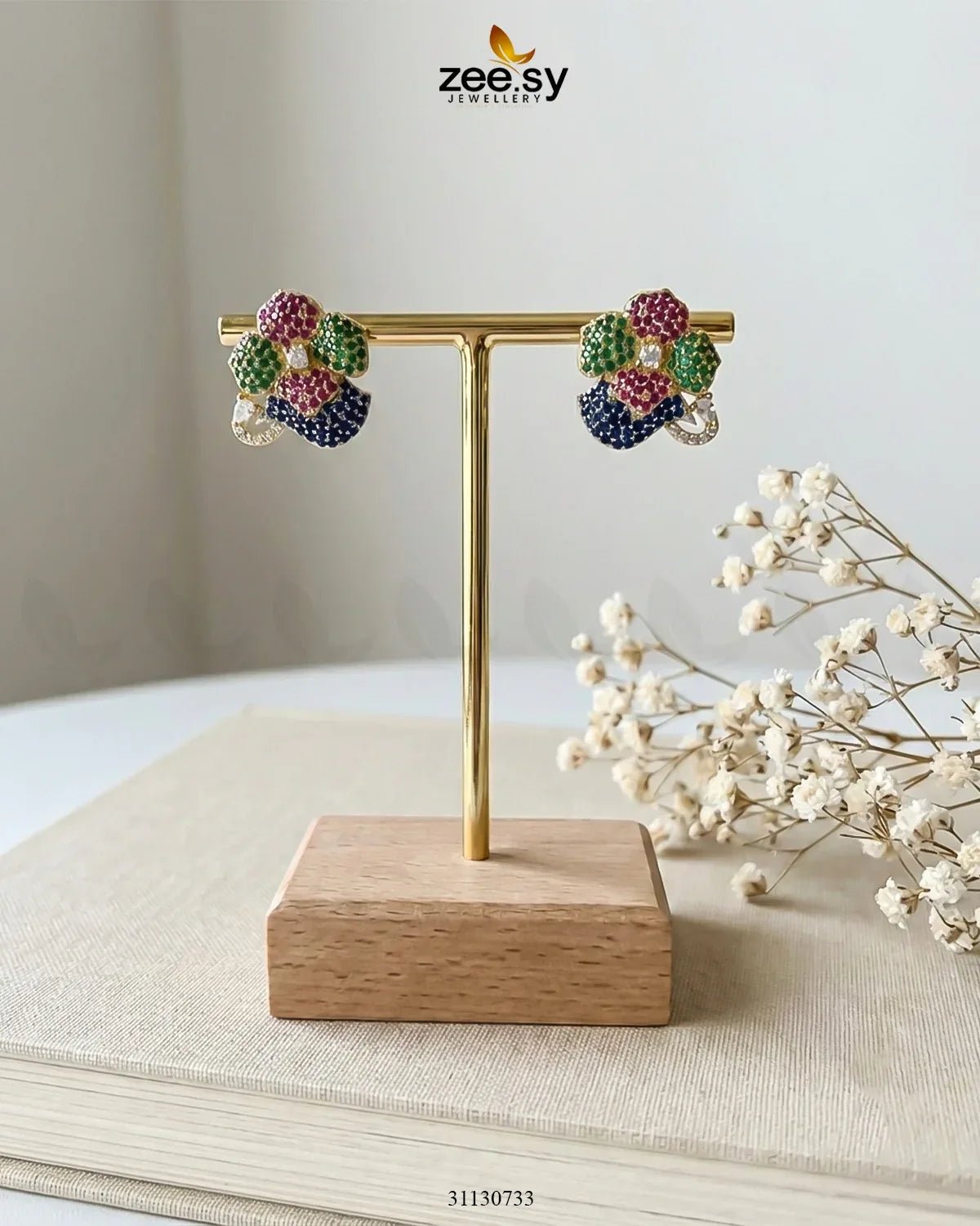 Golden Sapphires Floral Crystal Earrings by RHS09 featuring intricate floral designs and shimmering golden sapphires.