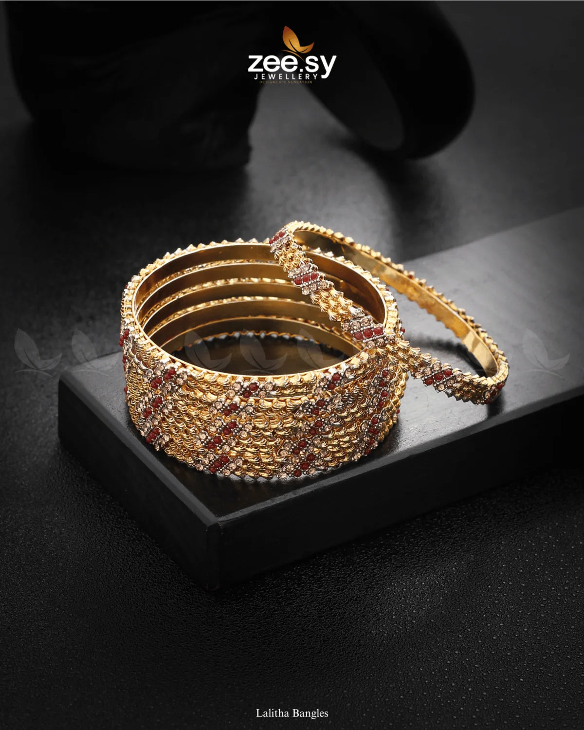 Lalitha Bangles feature intricate craftsmanship with delicate stone embellishments and rhodium-polished accents. Their shimmering elegance makes them a perfect statement piece for weddings and festive occasions. Designed to complement ethnic and bridal wear effortlessly, they exude timeless charm.