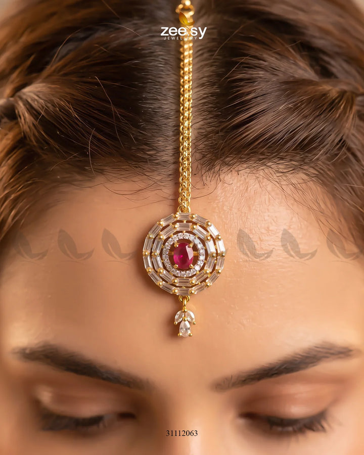 Fuchsia Liana Bindiya from RHS09, traditional decorative forehead bindi with intricate design and vibrant color.