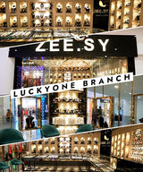 Zee.Sy jewelry store with 'Luckyone Branch' sign in a shopping mall.