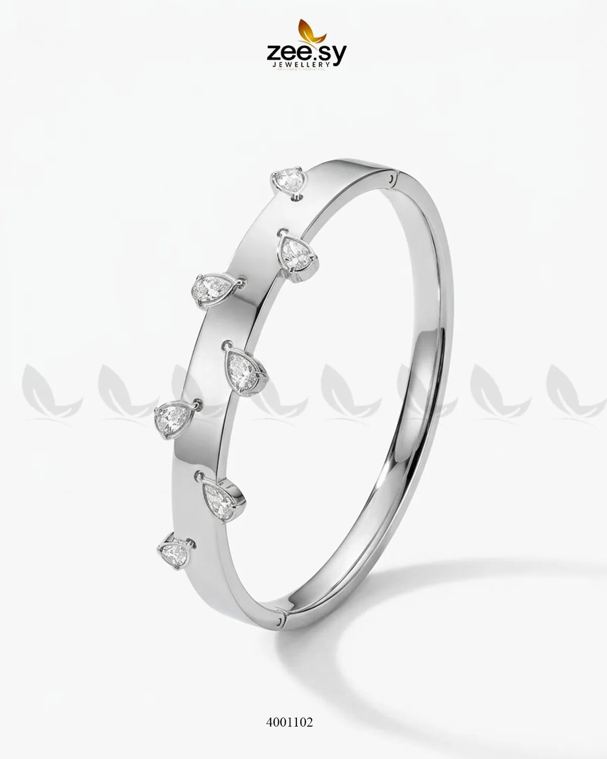 Silver minimalist droplet cuff bracelet by MH26, featuring a sleek, modern design with smooth, curved edges.