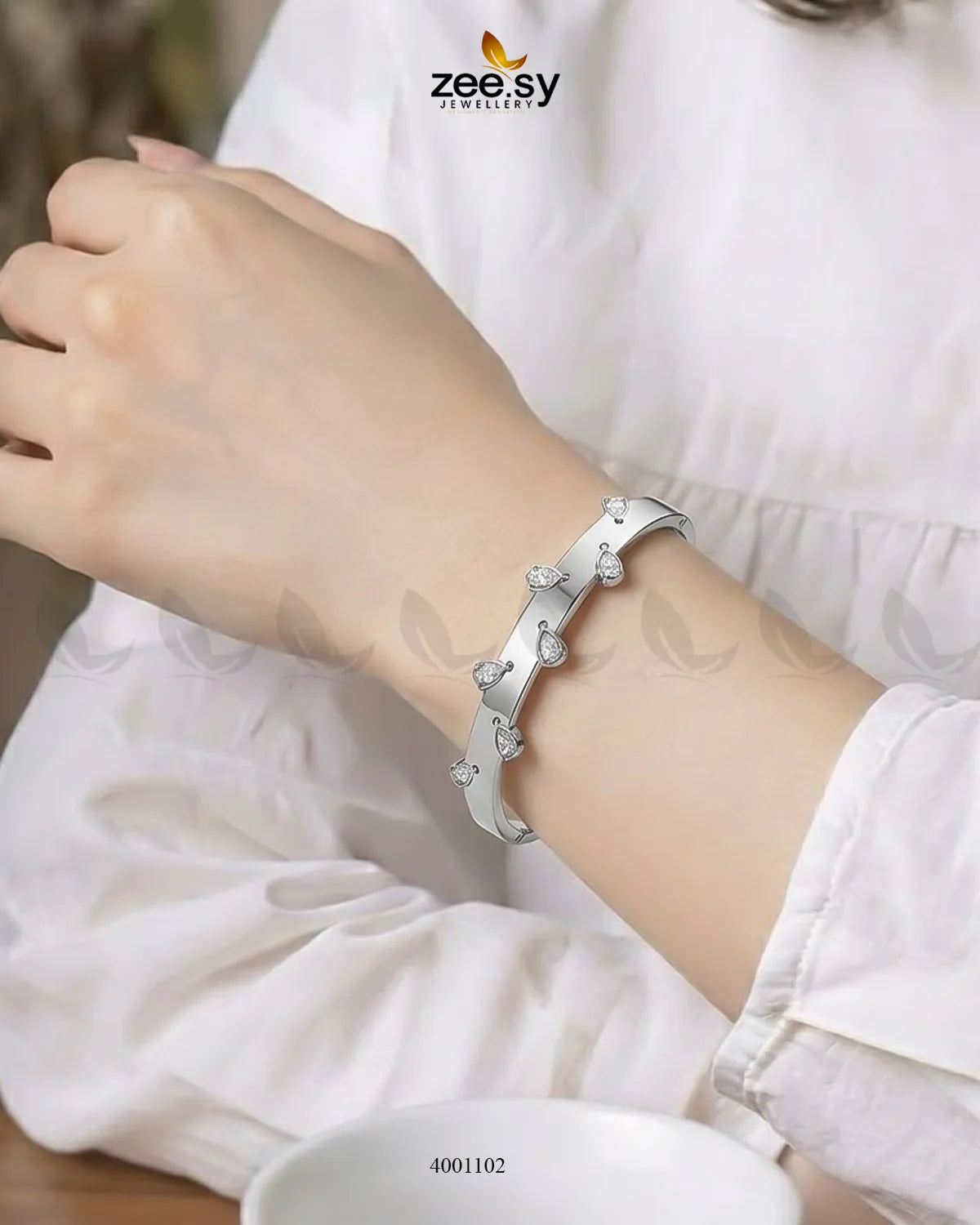 Silver minimalist droplet cuff bracelet by MH26 featuring sleek, modern design and smooth curved edges.