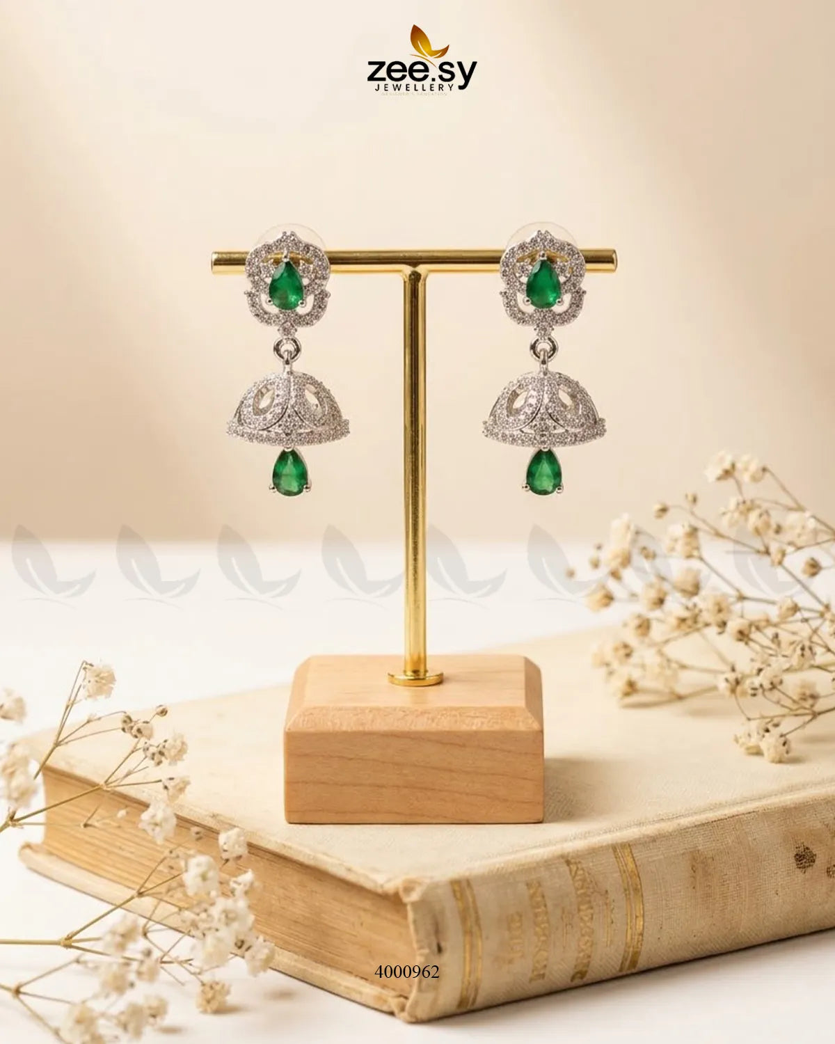 Ornate American diamond jhumka earrings with intricate design and gold finish, showcasing traditional Indian jewelry style.
