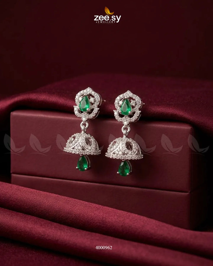 Ornate American diamond jhumka earrings with intricate design and gold finish, showcasing traditional Indian jewelry style.