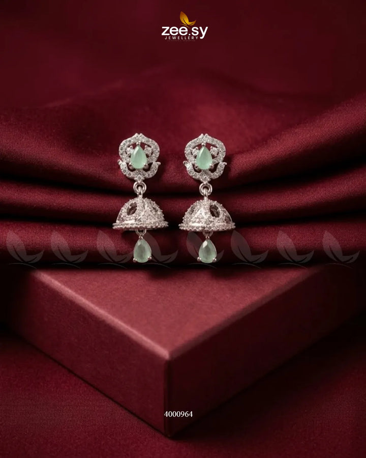 Ornate American diamond jhumka earrings by RHS09 featuring intricate design with mint and green accents, traditional Indian jewelry style