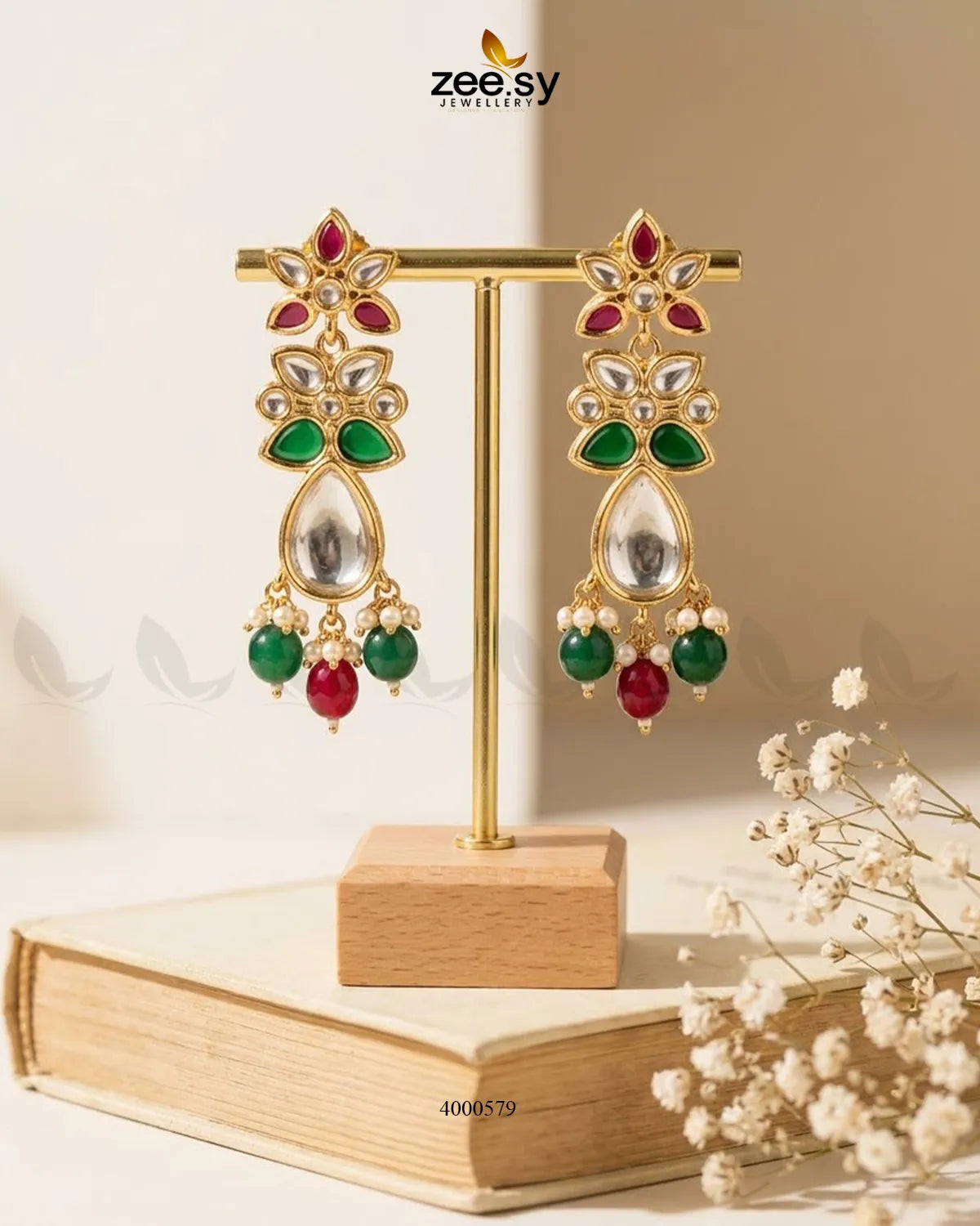 Ornate floral Polki statement earrings with intricate design in ruby and green hues, crafted by RHS09.
