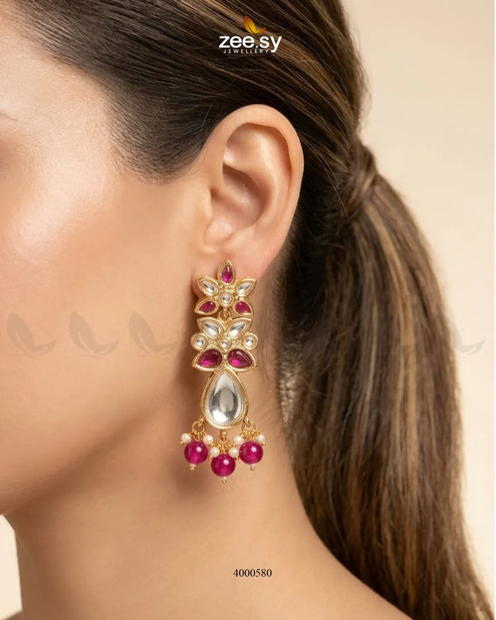 Purple ornate floral Polki statement earrings by RHS09 featuring intricate design and traditional Indian jewelry craftsmanship.