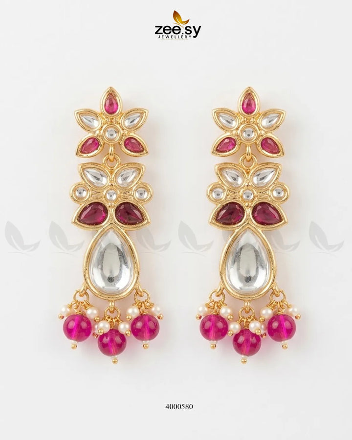 Purple ornate floral Polki statement earrings by RHS09 featuring intricate design and traditional craftsmanship.