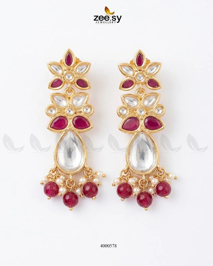 Ornate floral Polki statement earrings with intricate design and ruby accents, showcasing RHS09 brand craftsmanship.
