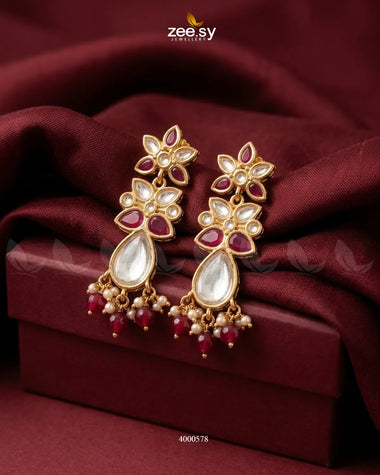 Ornate floral Polki statement earrings by RHS09 with intricate design and ruby accents, perfect for elegant traditional attire.