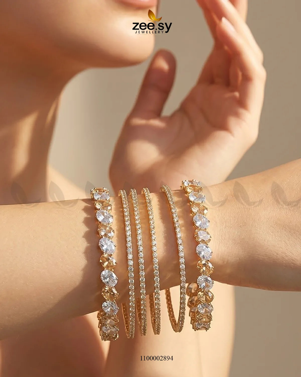 Elegant AJ03 oval gemstone paved bangles with shimmering stones, showcasing a sophisticated bracelet design in champagne tones.